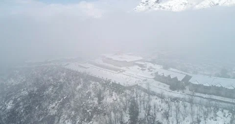 Aerial view showcasing snow-covered kashmir wrapped in snow showcasing zabrawan Stock Footage 310656468