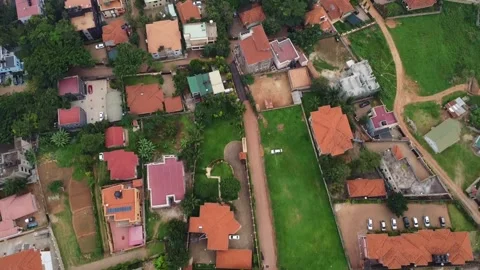 Aerial view showcasing an upscale residential neighborhood, displaying lush Stock Footage 314472210