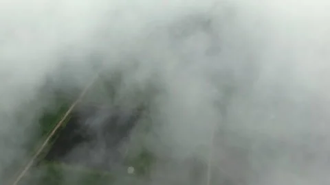 Aerial view showing dense clouds in the countryside. Stock Footage 334751191