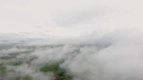 Aerial view showing dense clouds in the countryside. Stock Footage 334751313