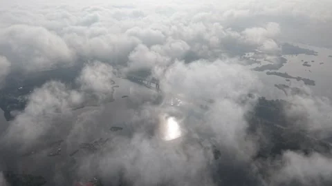 Aerial view shows clouds over water and islands Stock-Footage 339833665