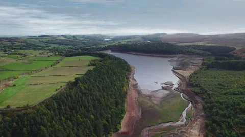 Aerial view shows a large, partially dried reservoir Stock-Footage 343870097