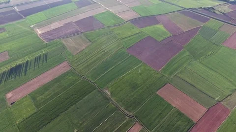Aerial view shows patchwork agricultural - Rural Agriculture and Farmland Plots Stock Footage 339366668
