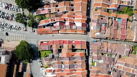 An aerial view shows the rooftops and streets of a historic city Stock Footage 312390576