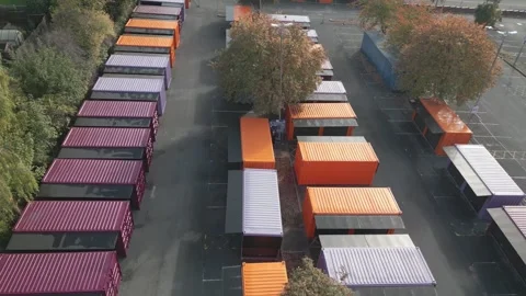 Aerial view shows rows of colorful shipping containers 스톡 동영상 343689775