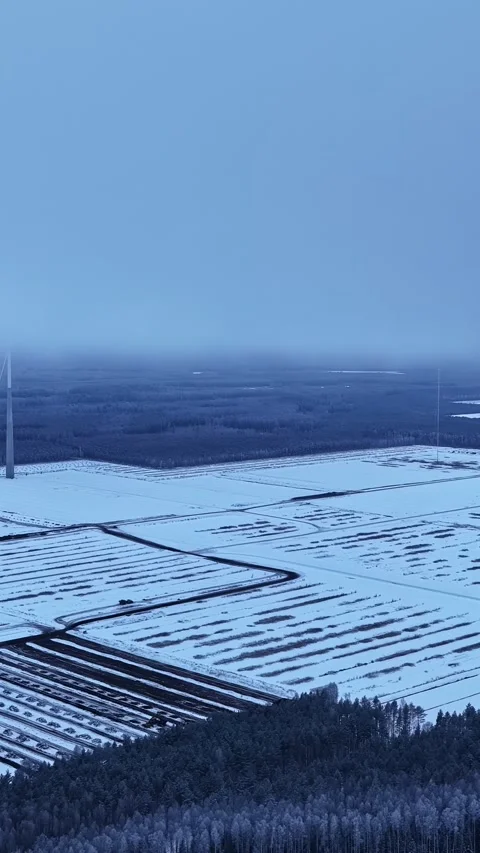 Aerial View Shows Snow Covered Peat Fields Under Twilight Blue Sky Stockbeeldmateriaal 339766769