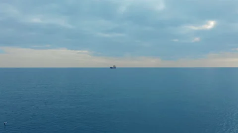 Aerial view. Side view of red cargo ship floating in the sea. Stock Footage 140340998