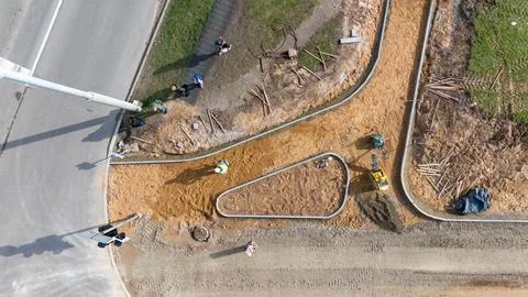 Aerial view of sidewalk construction with workers and equipment Stock Photos