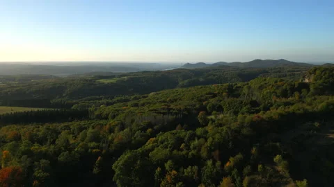 Aerial view of the Siebengebirge during fall with Rhine and Bonn in the distance Stock Footage 220744983