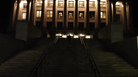 Aerial View of Silhouetted Man Walking Towards Capitol Building Stock Footage 146551759