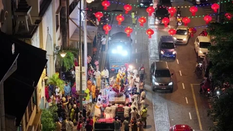 Aerial view of silver horse chariot procession highlights devotees devotion Stock-Footage 332090853