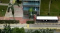 Aerial View of Singapore, Bus Stop in China Town, Busses and Cars Traffic HD Footage