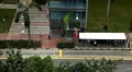 Aerial View of Singapore, Bus Stop in China Town, Busses and Cars Traffic HD Footage