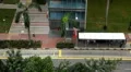 Aerial View of Singapore, Bus Stop in China Town, Busses and Cars Traffic HD Footage