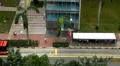 Aerial View of Singapore, Bus Stop in China Town, Busses and Cars Traffic HD Footage