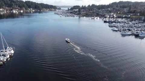 Aerial view of a single boat sailing through Gig Harbor, WA Video stock 147364079