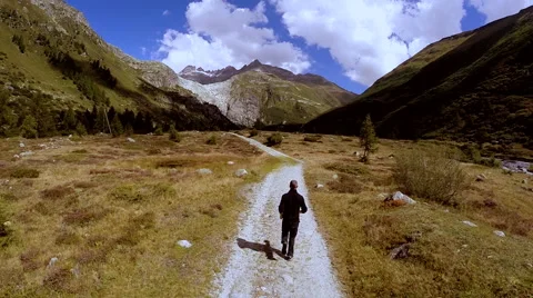 Aerial view of single man doing recreational activity in mountain landscape Stock Footage 42280741