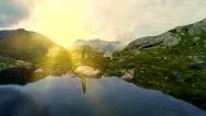 Aerial View Of Single Man Hiker Alone In Mountain Lake Landscape Stock Footage