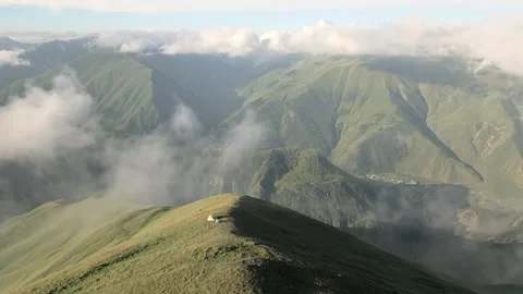 Aerial view single one tent on hilltop with green caucasus mountains panora.. Stock Footage 309331107