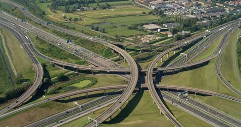 Aerial view of six intersecting highways near the Hague, Netherlands Vidéo 114132701