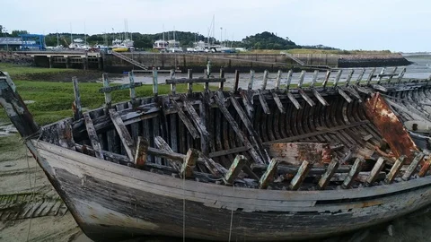 Aerial view. Skeleton of an old abandoned wooden boat. Cemetery of dead ships. 스톡 동영상 113648353