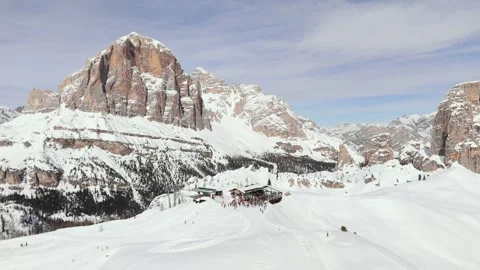 Aerial view of ski resort lodge with skiers near Cinque Torri Dolomites Mountain Stock Footage 286372453