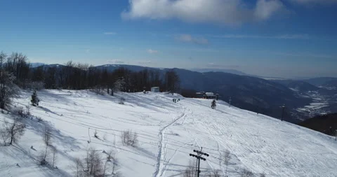 Aerial view: The ski slope is full of skiers. Winter sports. Skis Stock Footage 166420178