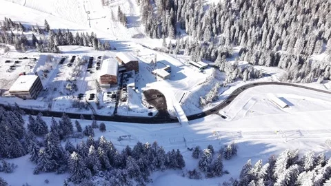 Aerial View of Ski Slopes and Mountain Road With Traffic and Skiers Видео 331644331