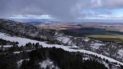 Aerial view of ski slopes and stormy sky over plains, La Pinilla, Spain Stock Footage 339305050