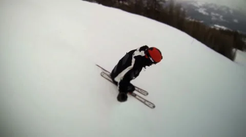 Aerial view of a skier starting down the mountain. HD Stock Footage 52442517