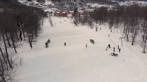 Aerial view of a skiing instructor with students at a ski school. Stock Footage 122263774