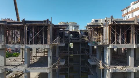 Aerial View: Skilled crane operator mounts large parts while scaling ladders Vídeo Stock 296025203
