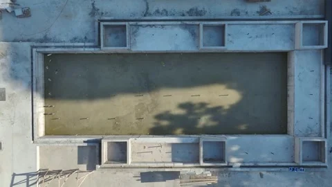 Aerial View: Skilled operator assembles crane parts and climbs high ladders Vídeo Stock 296025831