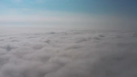 Aerial view of the sky and clouds that the camera flies into Stock Footage 146487177