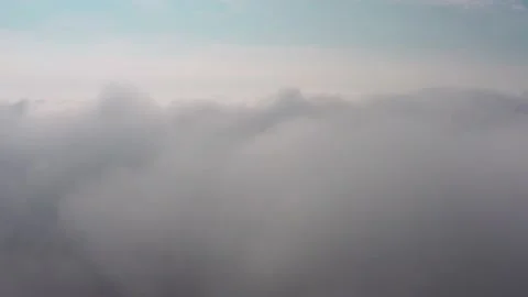 Aerial view of the sky and clouds that the camera flies into Stock Footage 146805523