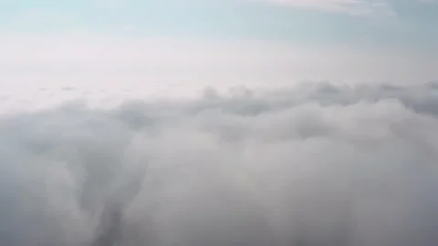 Aerial view of the sky and clouds that the camera flies into Vídeo Stock 146935973