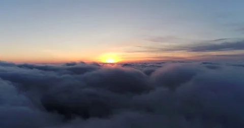 Aerial view of sky over the clouds in the sunset. Top view. Stock Footage 84048871