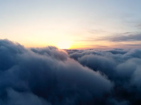 Aerial view of sky over the clouds in the sunset. Top view. Stock Footage 84048897