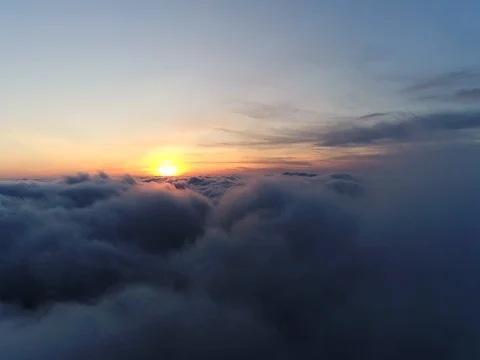 Aerial view of sky over the clouds in the sunset. Top view. 動画素材 84048937