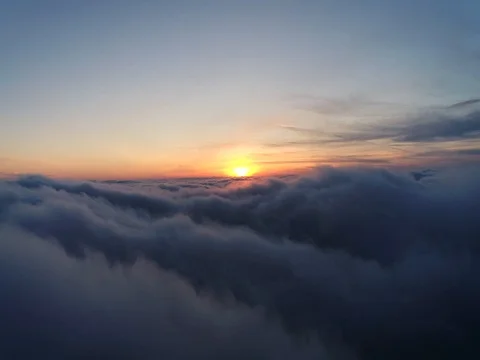 Aerial view of sky over the clouds in the sunset. Top view. Stock Footage 84048946