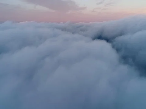 Aerial view of sky over the clouds in the sunset. Top view. 動画素材 84048970