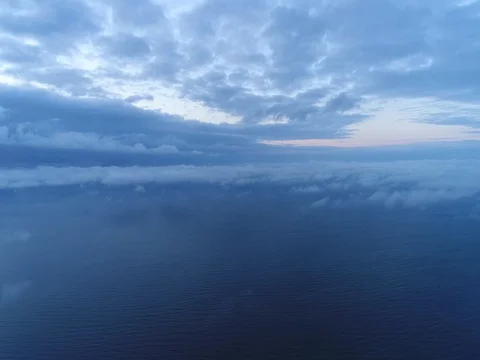 Aerial view of sky over the clouds in the sunset. Top view. Stock Footage 84296647