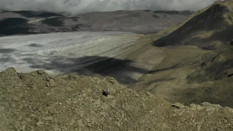 Aerial view of sky-runner running high in the mountains. Stock Footage 138577642