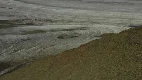 Aerial view of sky-runner running high in the mountains. Stock Footage 138577941
