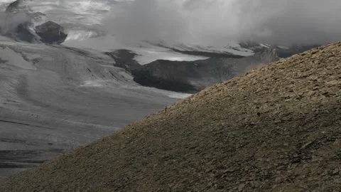 Aerial view of sky-runner running high in the mountains. Stock Footage 138578160