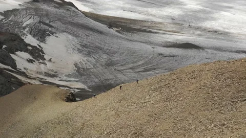 Aerial view of sky-runner running high in the mountains. Video stock 138578792