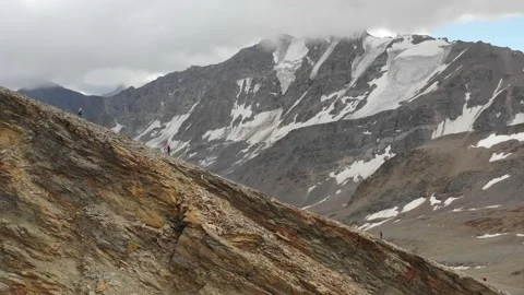 Aerial view of sky-runner running high in the mountains. Stock Footage 140973375