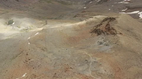 Aerial view of sky-runner running high in the mountains. Stock Footage 140973603