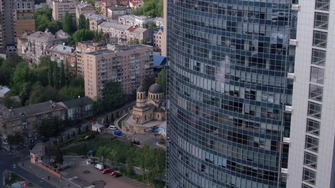 Aerial view of the skyscraper and window cleaners washing the windows Stock Footage 93349259