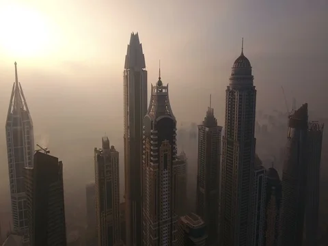 Aerial view of skyscrapers in Dubai Marina, at foggy sunrise. Stock Footage